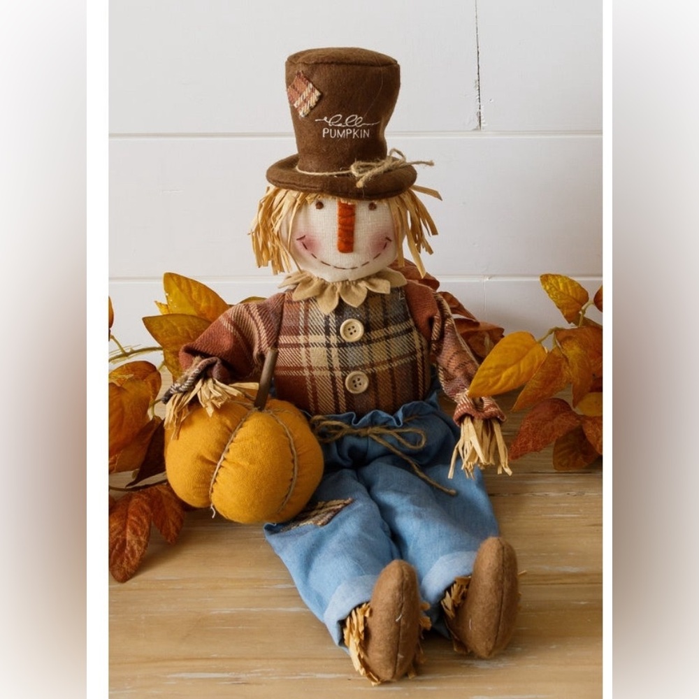 S0LD Scarecrow Sitter Holding Pumpkin